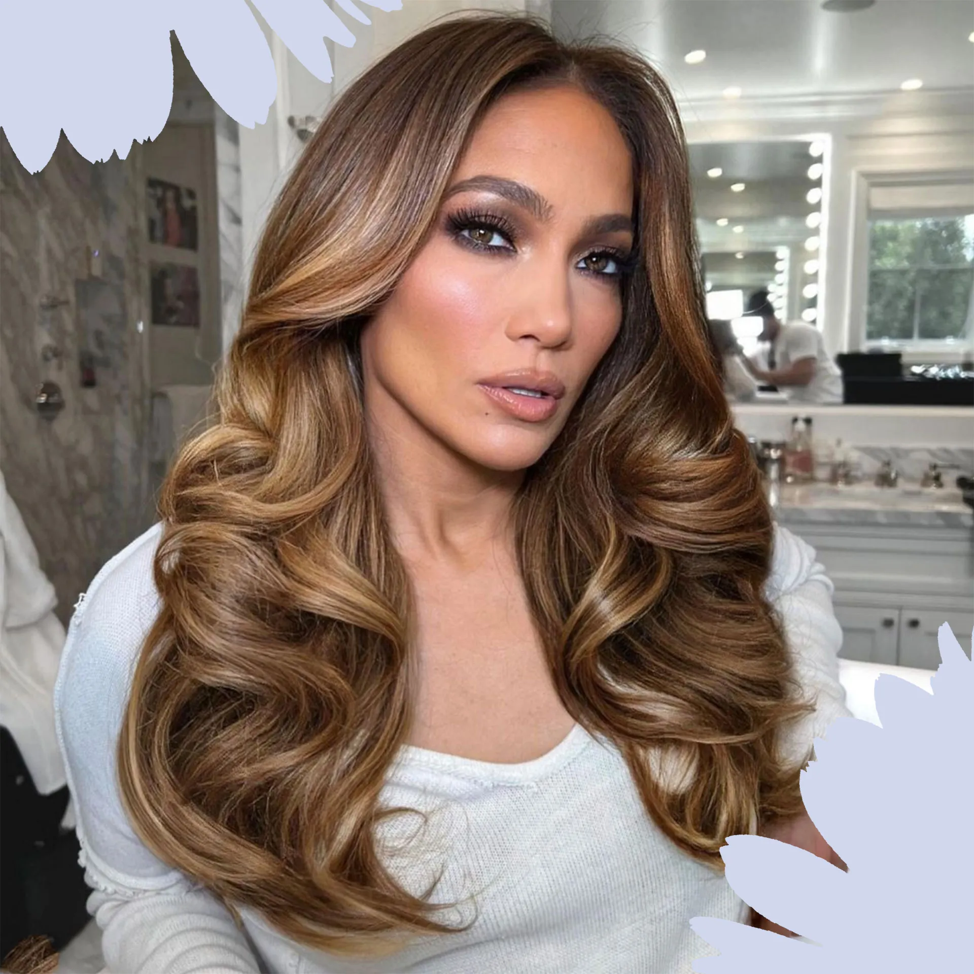Jennifer Lopez modeling the 90s supermodel blowout hair trend with voluminous waves